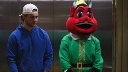 NJ Devil as Buddy in the Elevator Scene
