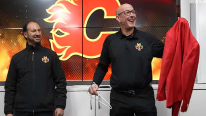 Star wears Calgary flames red blazer player game